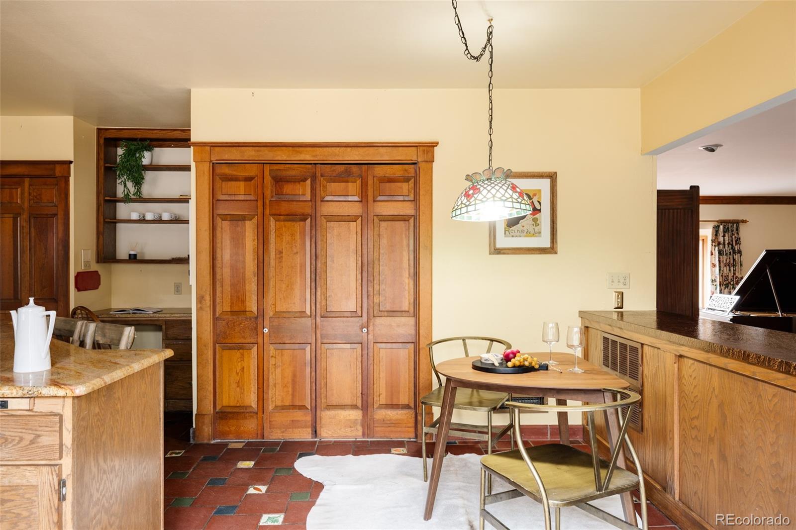 14080 Crabapple Road Golden, CO 80401 - Photo 11 of 50 a view of a dining room with furniture and a window