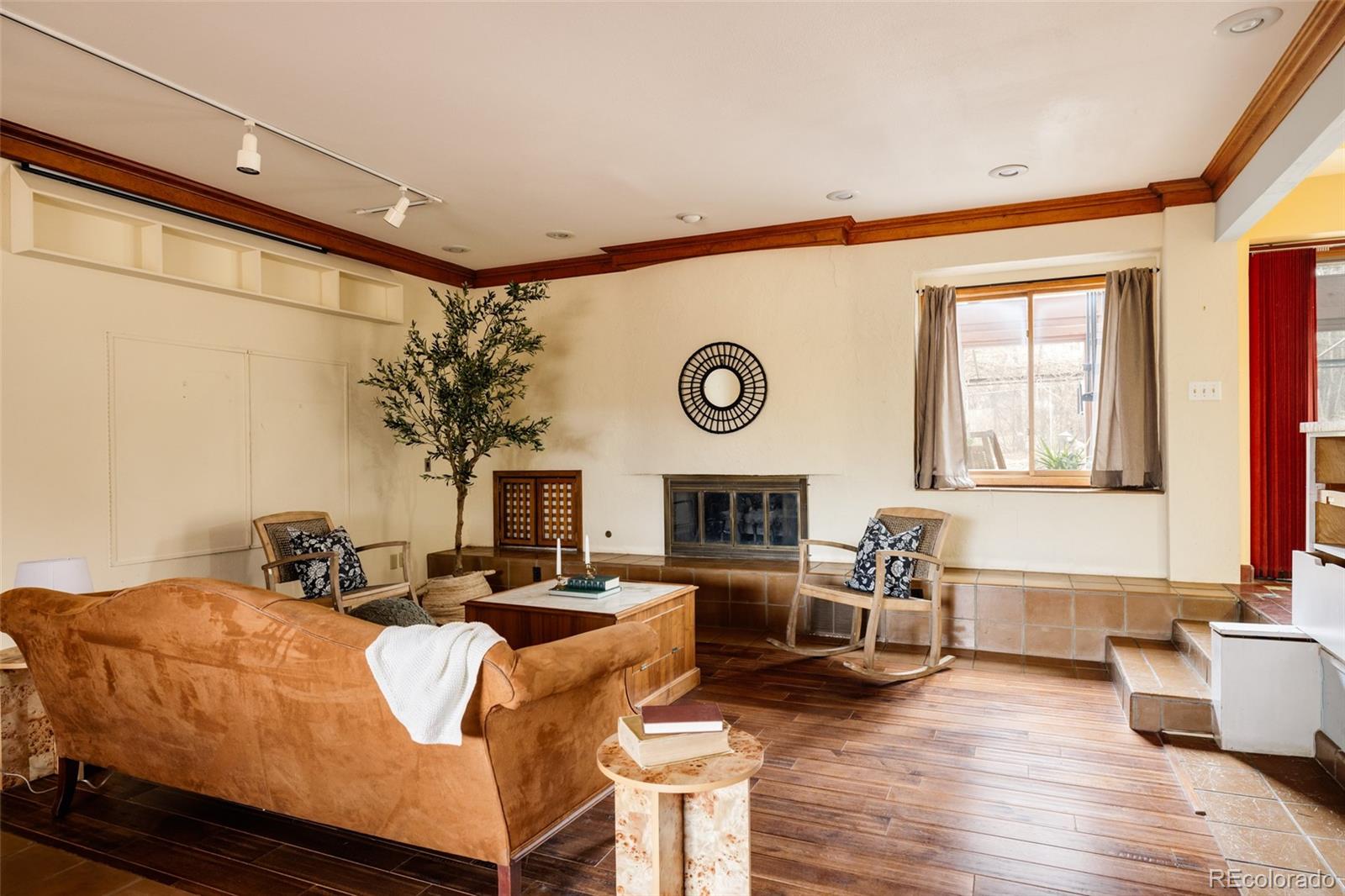 14080 Crabapple Road Golden, CO 80401 - Photo 15 of 50 a living room with fireplace furniture and a large window