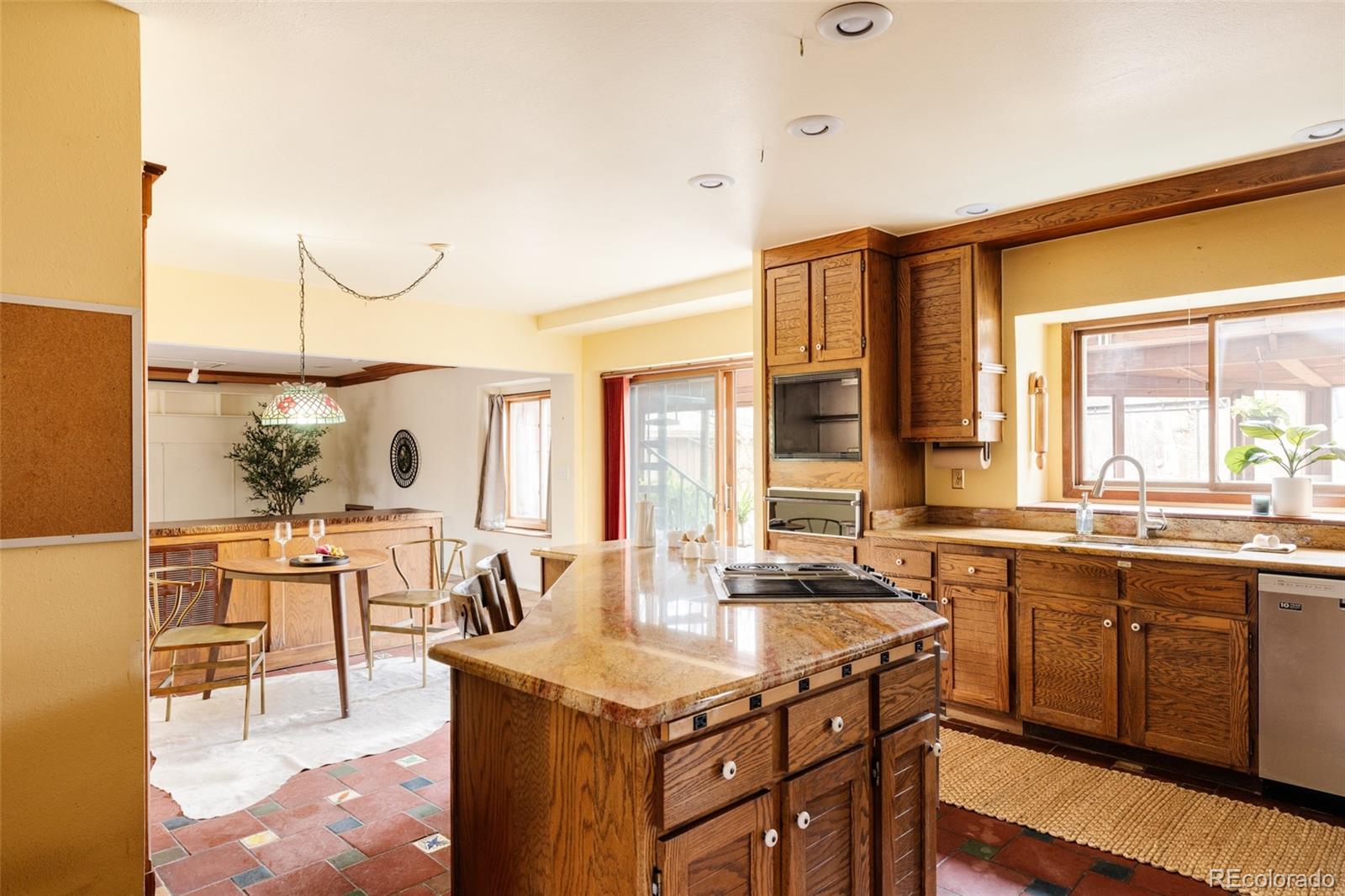 14080 Crabapple Road Golden, CO 80401 - Photo 10 of 50 a kitchen with center island table and chairs