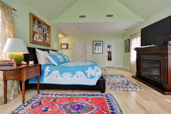 3 Wildon Road Wellesley, MA 02482 - Photo 16 of 27 a bedroom with a bed and a flat screen tv