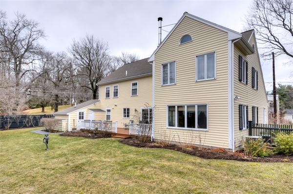 3 Wildon Road Wellesley, MA 02482 - Photo 26 of 27 a view of a white house with a yard and large trees