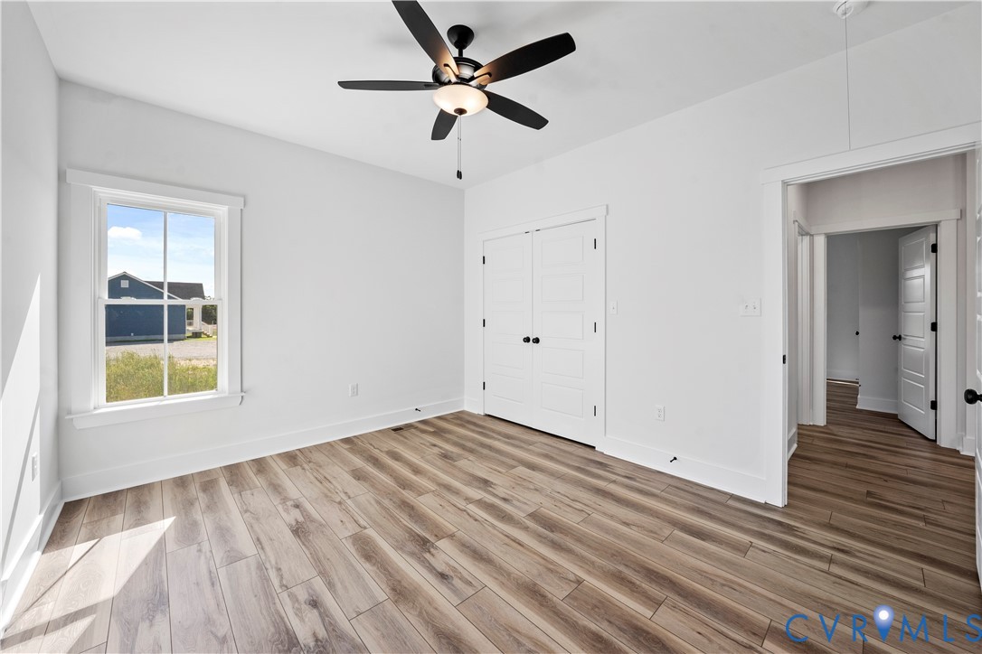 1841 Cartersville Road Goochland, VA 23063 - Photo 23 of 34 a view of an empty room with wooden floor and a window