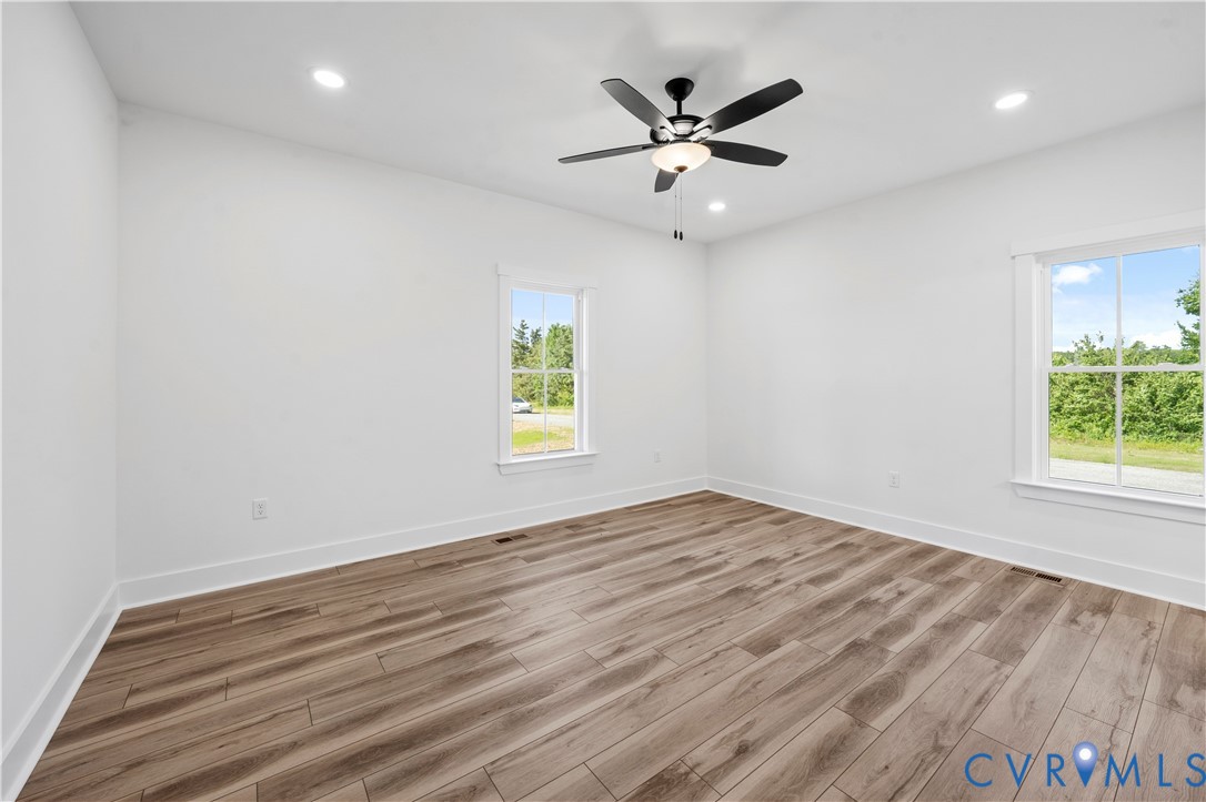 1841 Cartersville Road Goochland, VA 23063 - Photo 24 of 34 an empty room with window and ceiling fan