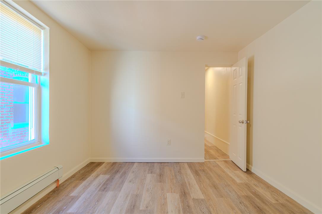 820 North 5th Street Allentown, PA 18102 - Photo 26 of 39 A quiet space with light flooring and ample natural light through a large window.