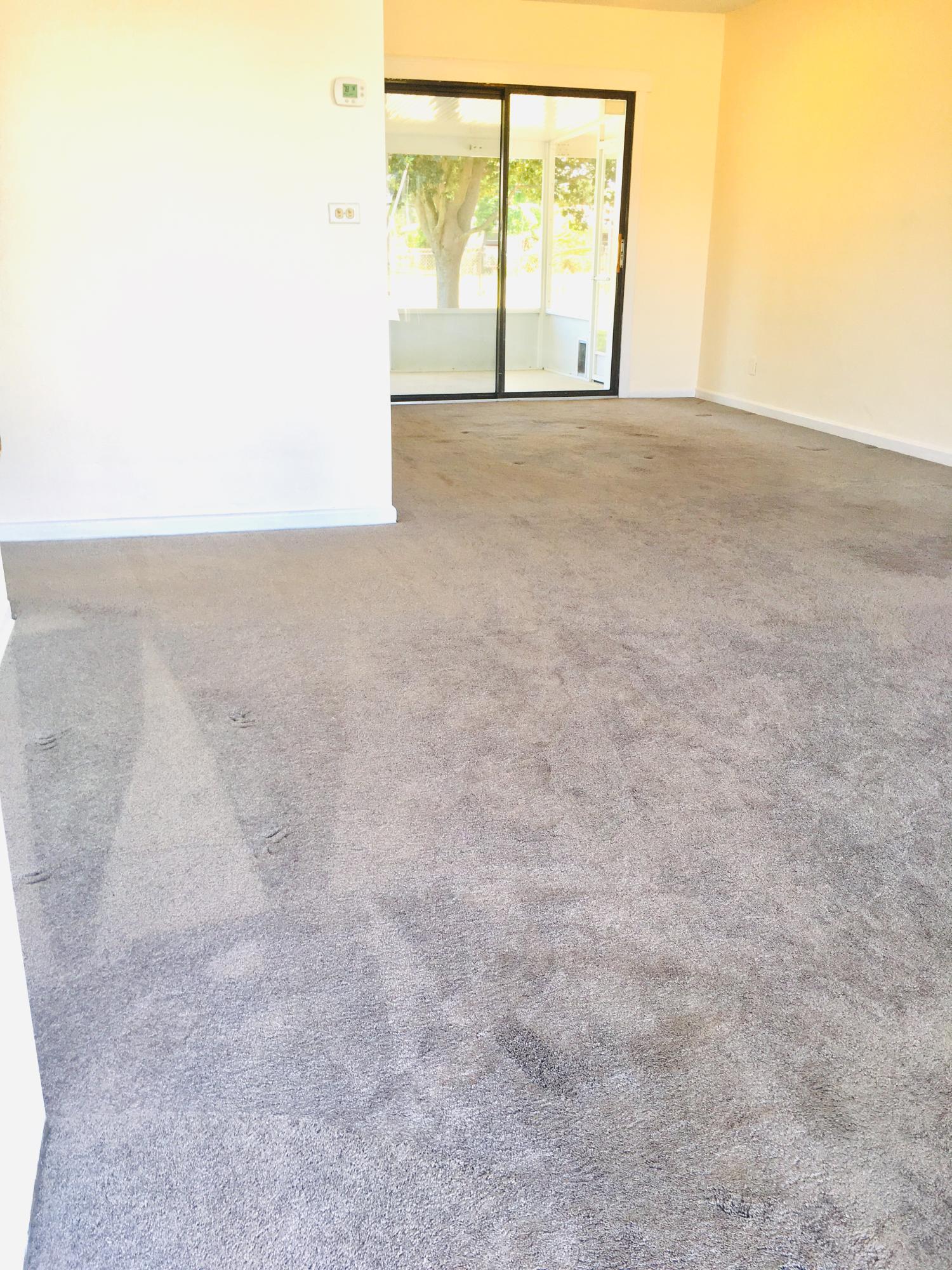 321 Winged Foot Road Palm Springs, FL 33461 - Photo 22 of 30 livng room with slider to back patio