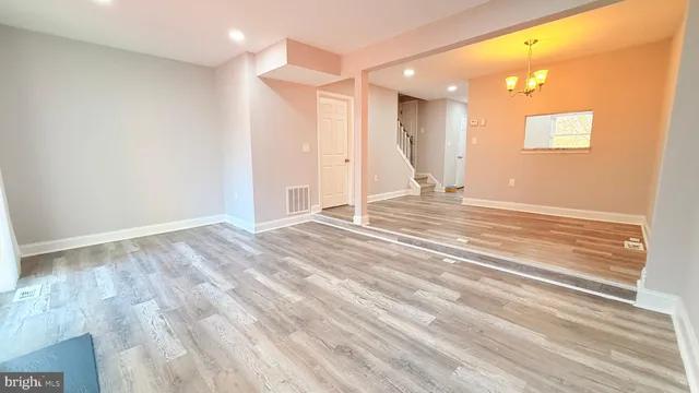 a view of a livingroom with wooden floor