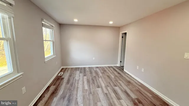 a view of an empty room and window