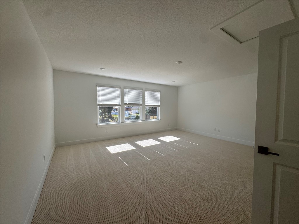 96112 Pirates Bluff Road Yulee, FL 32097 - Photo 8 of 10 an empty room with a empty space and windows