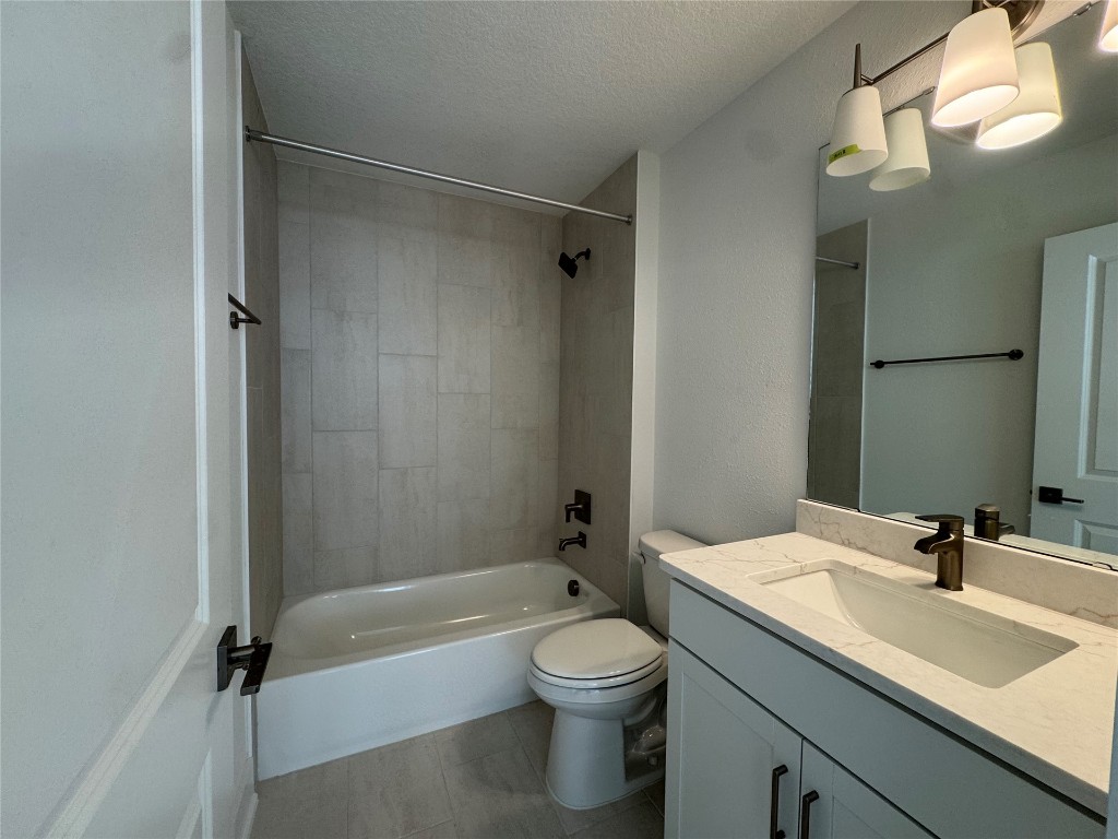 96112 Pirates Bluff Road Yulee, FL 32097 - Photo 9 of 10 a bathroom with a granite countertop sink toilet and shower