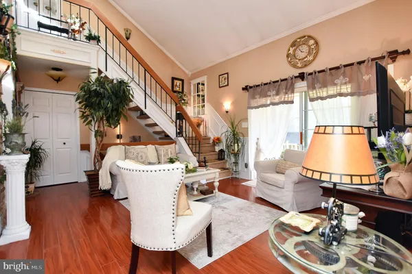 a view of a living room filled with furniture