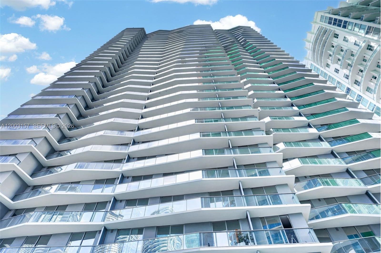 77 Southeast 5th Street, Unit 2705 Miami, FL 33131 - Photo 14 of 45 a view of a tall building
