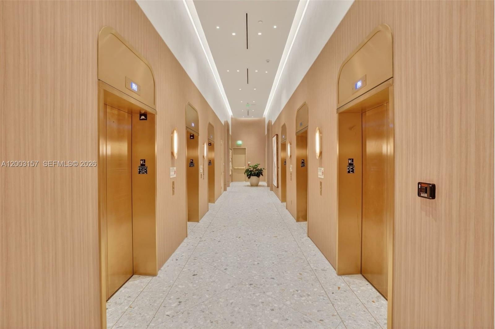 77 Southeast 5th Street, Unit 2705 Miami, FL 33131 - Photo 19 of 45 a view of a hallway with a dining area