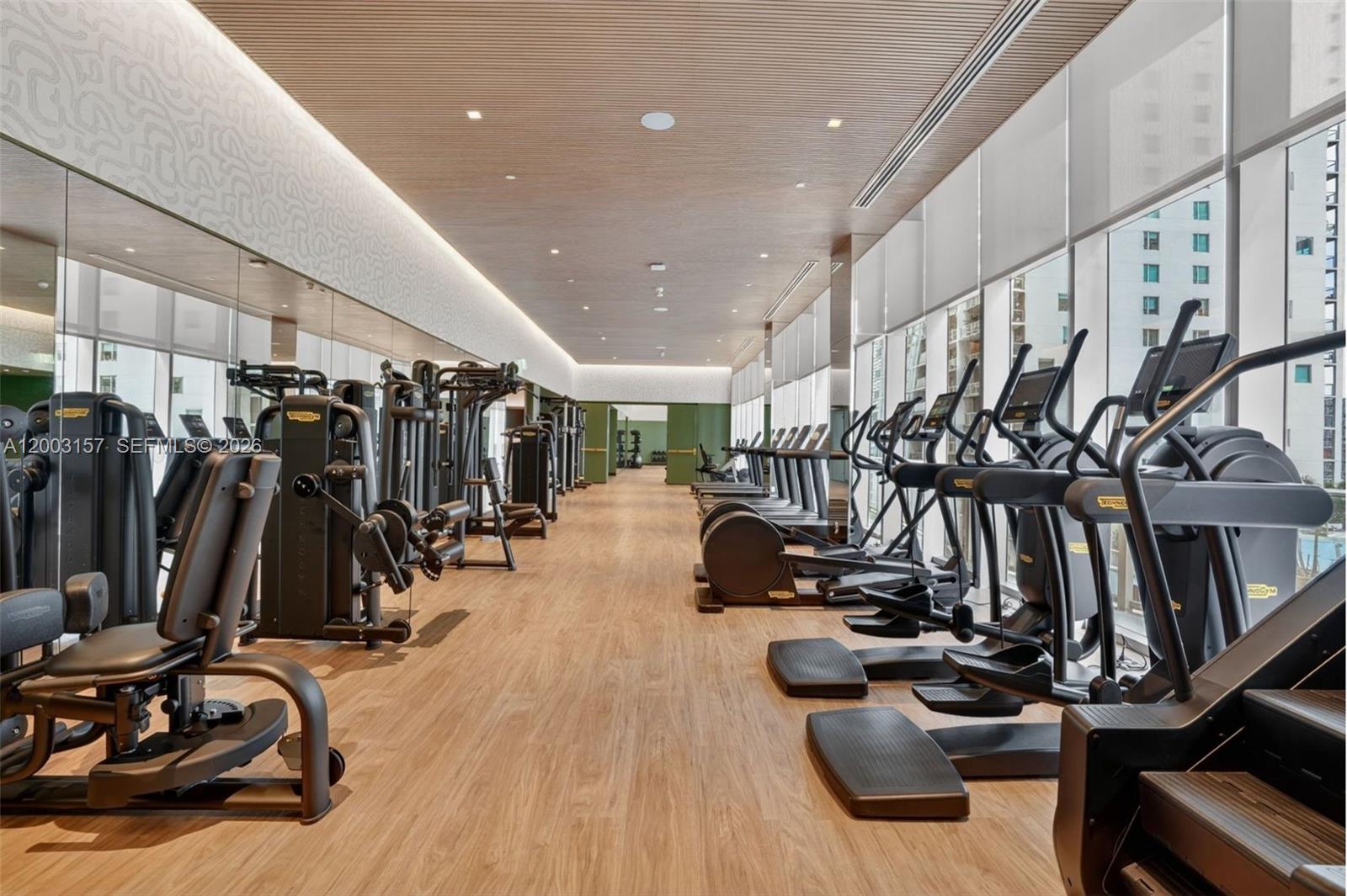 77 Southeast 5th Street, Unit 2705 Miami, FL 33131 - Photo 40 of 45 a view of a room with gym equipment