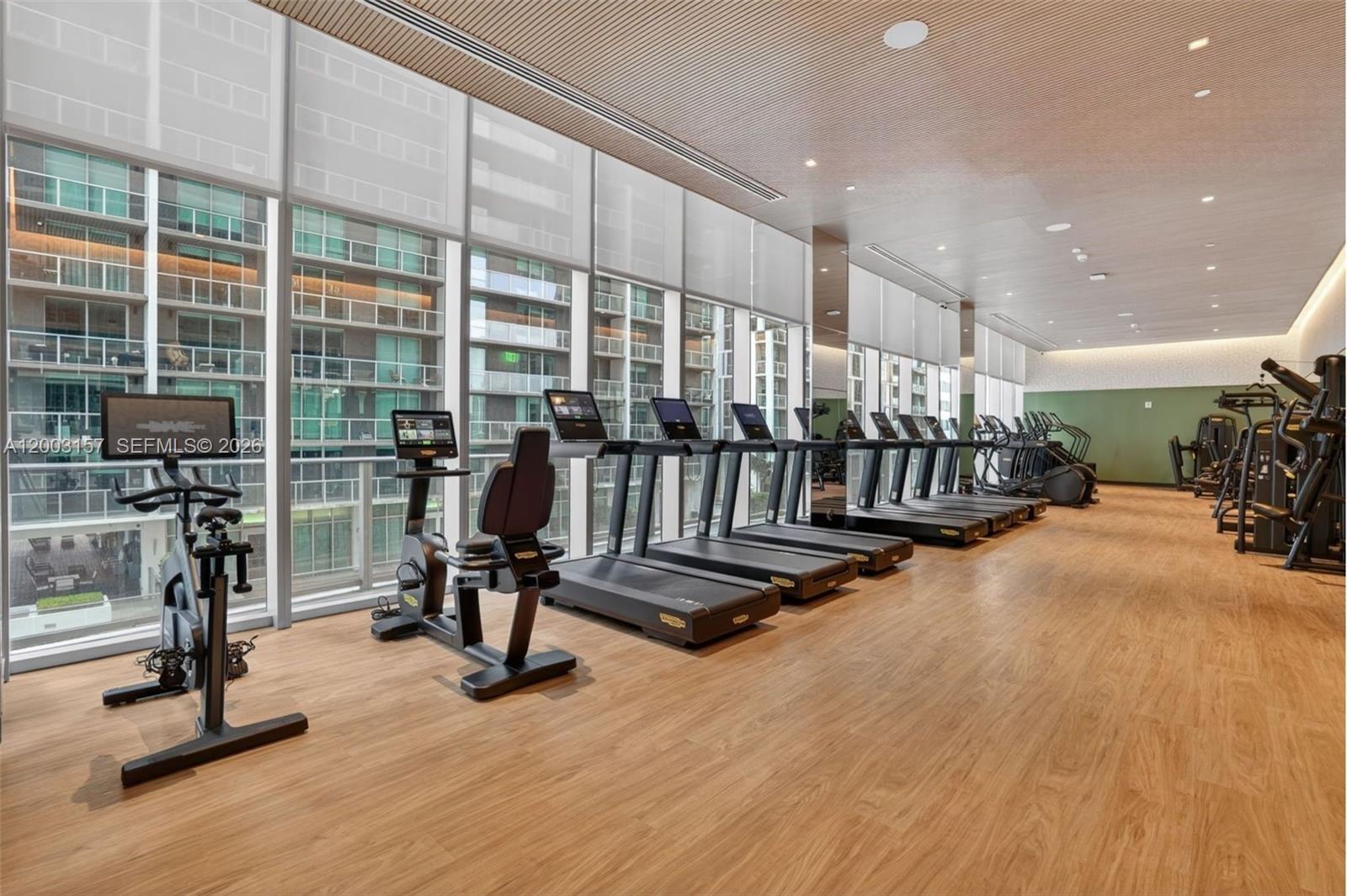77 Southeast 5th Street, Unit 2705 Miami, FL 33131 - Photo 41 of 45 a view of a room with gym equipment