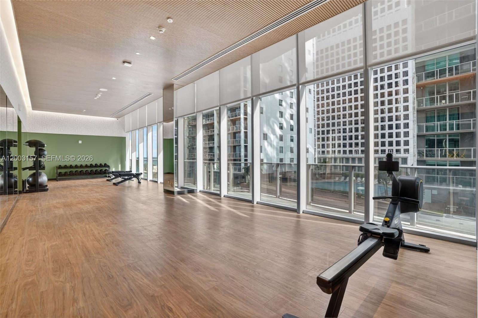 77 Southeast 5th Street, Unit 2705 Miami, FL 33131 - Photo 42 of 45 a view of a hall with wooden floor