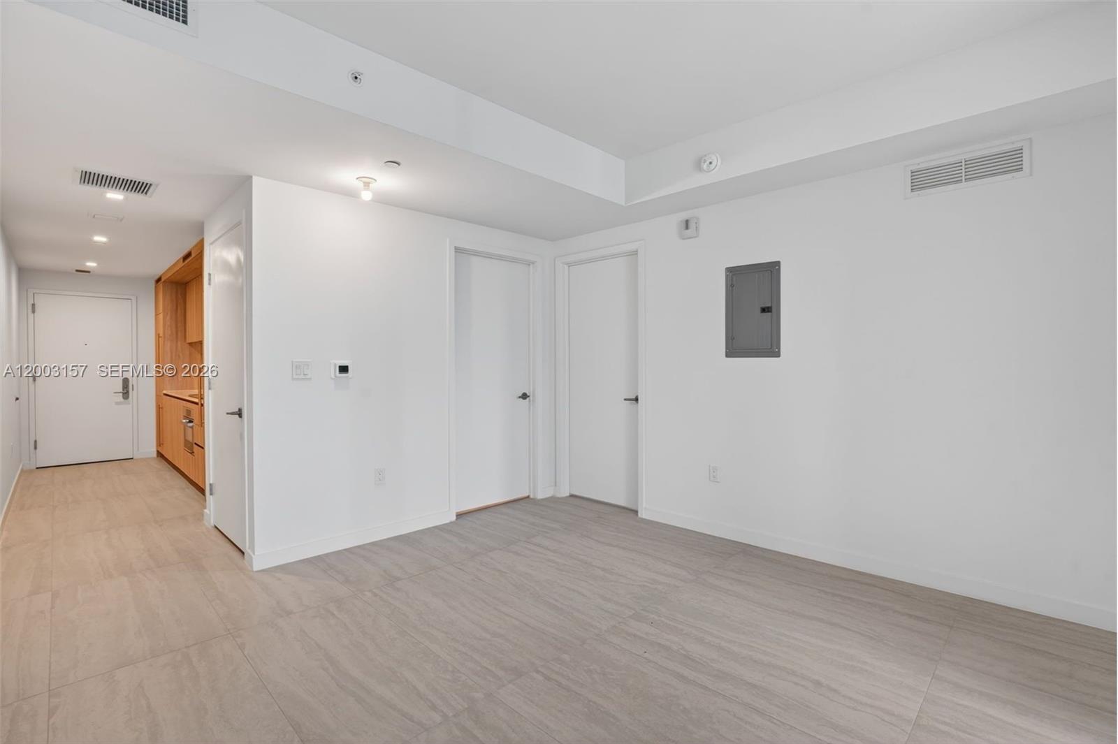77 Southeast 5th Street, Unit 2705 Miami, FL 33131 - Photo 7 of 45 wooden floor in an empty room with a window
