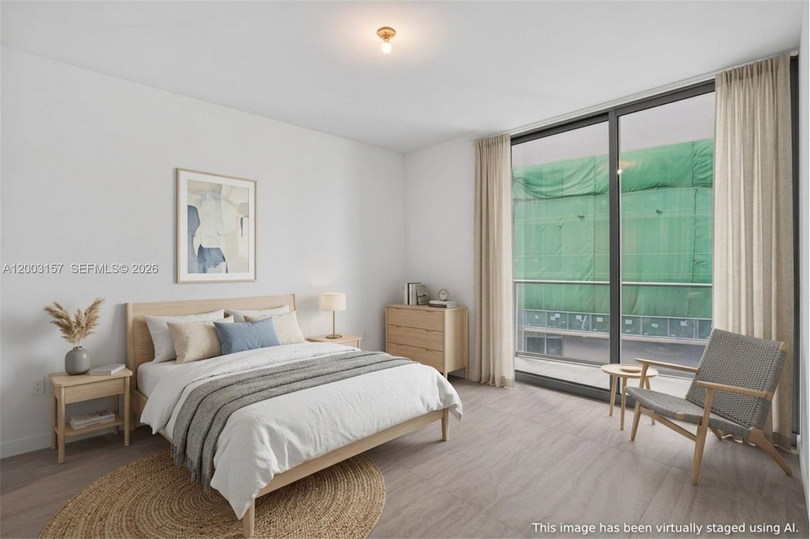 77 Southeast 5th Street, Unit 2705 Miami, FL 33131 - Photo 10 of 45 a bedroom with a large bed and a large window