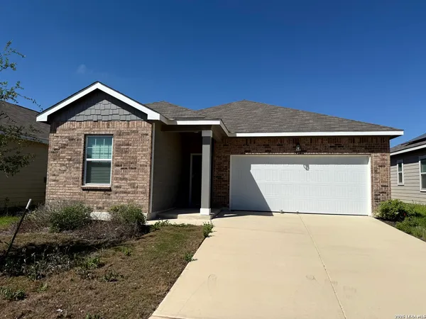 a front view of a house with yard