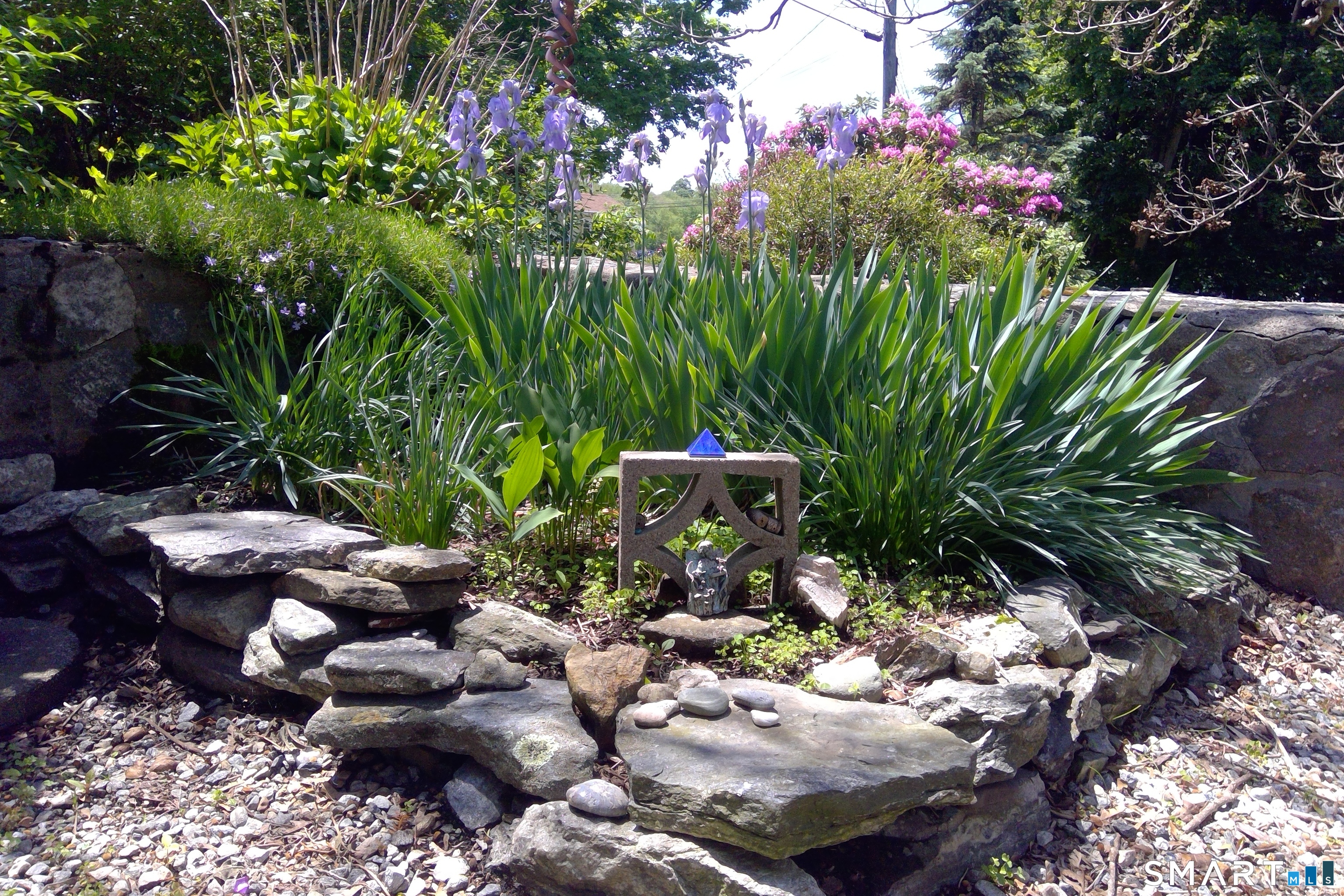 46 Station Road Windham, CT 06256 - Photo 31 of 34 whimsical garden on stone terrace