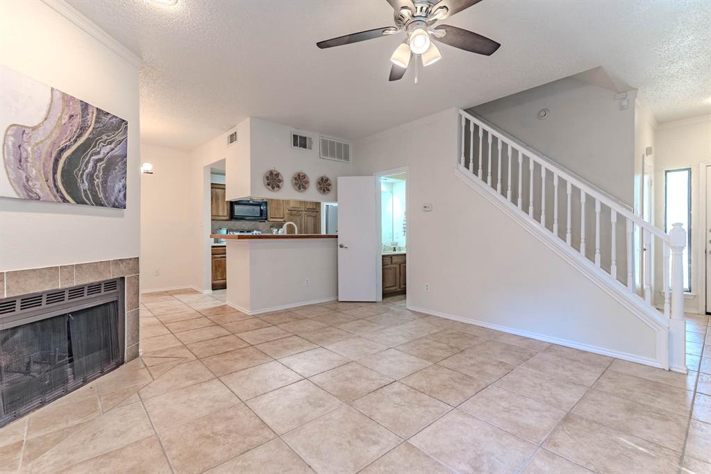 5619 Preston Oaks Road, Unit 706 Dallas, TX 75254 - Photo 3 of 23 Door under stairs is for the half bathroom.