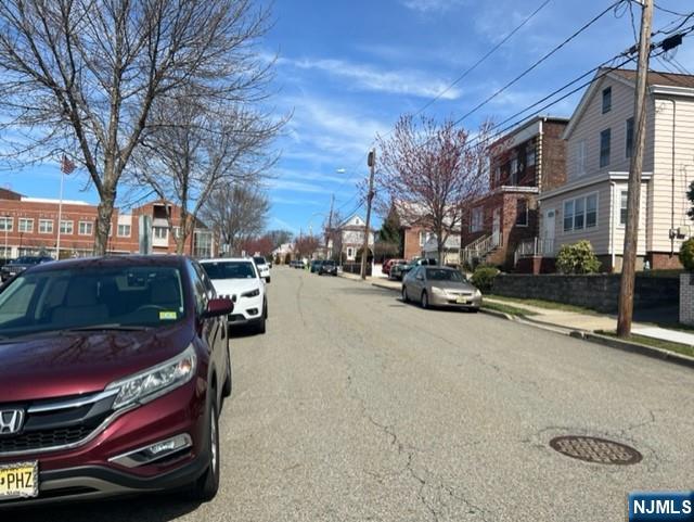551 Washington Street, Unit 2 Carlstadt, NJ 07072 - Photo 17 of 19 a city street lined with buildings and cars