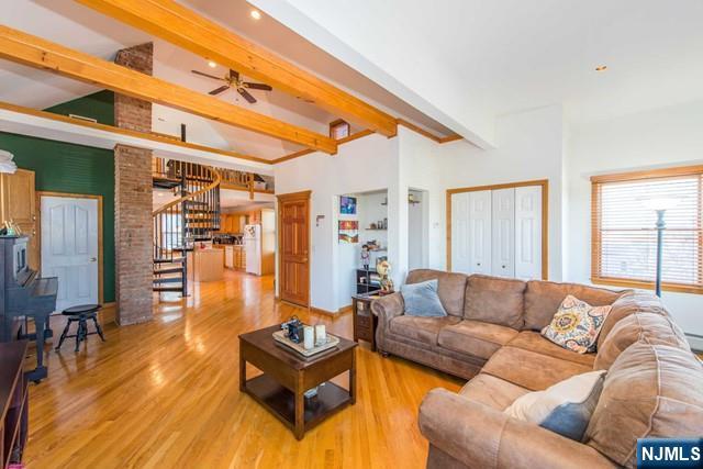 551 Washington Street, Unit 2 Carlstadt, NJ 07072 - Photo 3 of 19 a living room with furniture and wooden floor