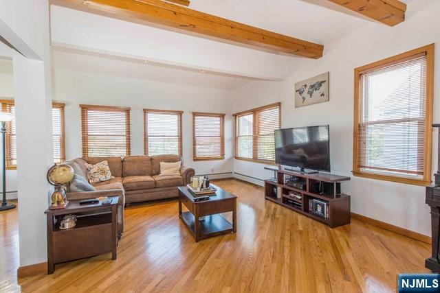 551 Washington Street, Unit 2 Carlstadt, NJ 07072 - Photo 4 of 19 a living room with furniture and a flat screen tv