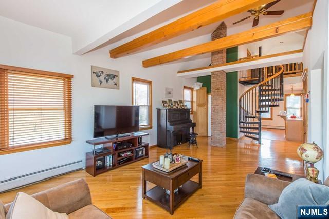 551 Washington Street, Unit 2 Carlstadt, NJ 07072 - Photo 5 of 19 a living room with furniture and a flat screen tv with wooden floor