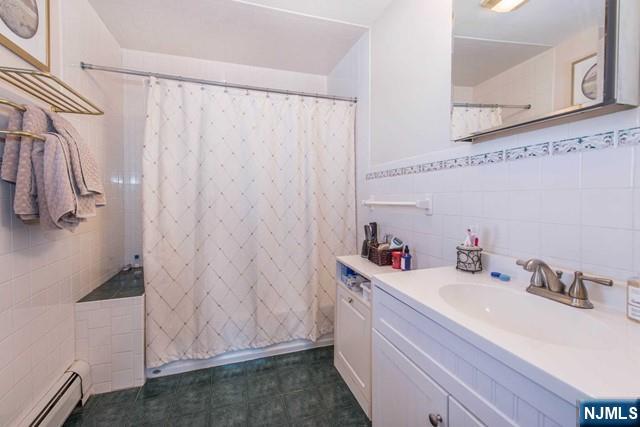 551 Washington Street, Unit 2 Carlstadt, NJ 07072 - Photo 9 of 19 a bathroom with a sink and a mirror