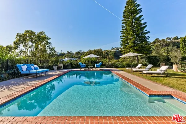 a view of a house with swimming pool