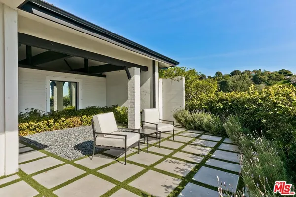 a view of a chairs and table on the terrace