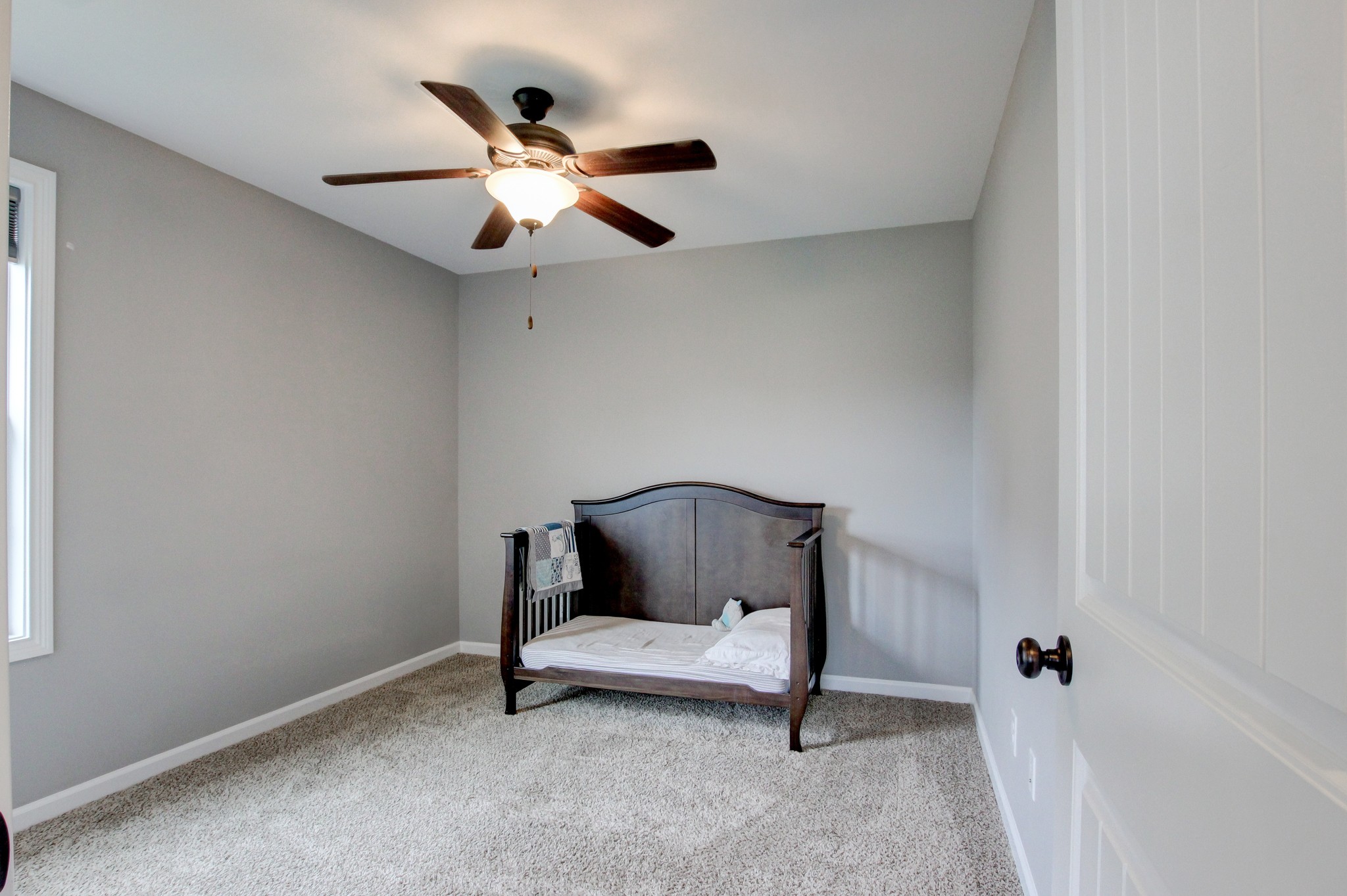 825 Rushing Drive Clarksville, TN 37042 - Photo 11 of 70 a bedroom with a bed and a ceiling fan