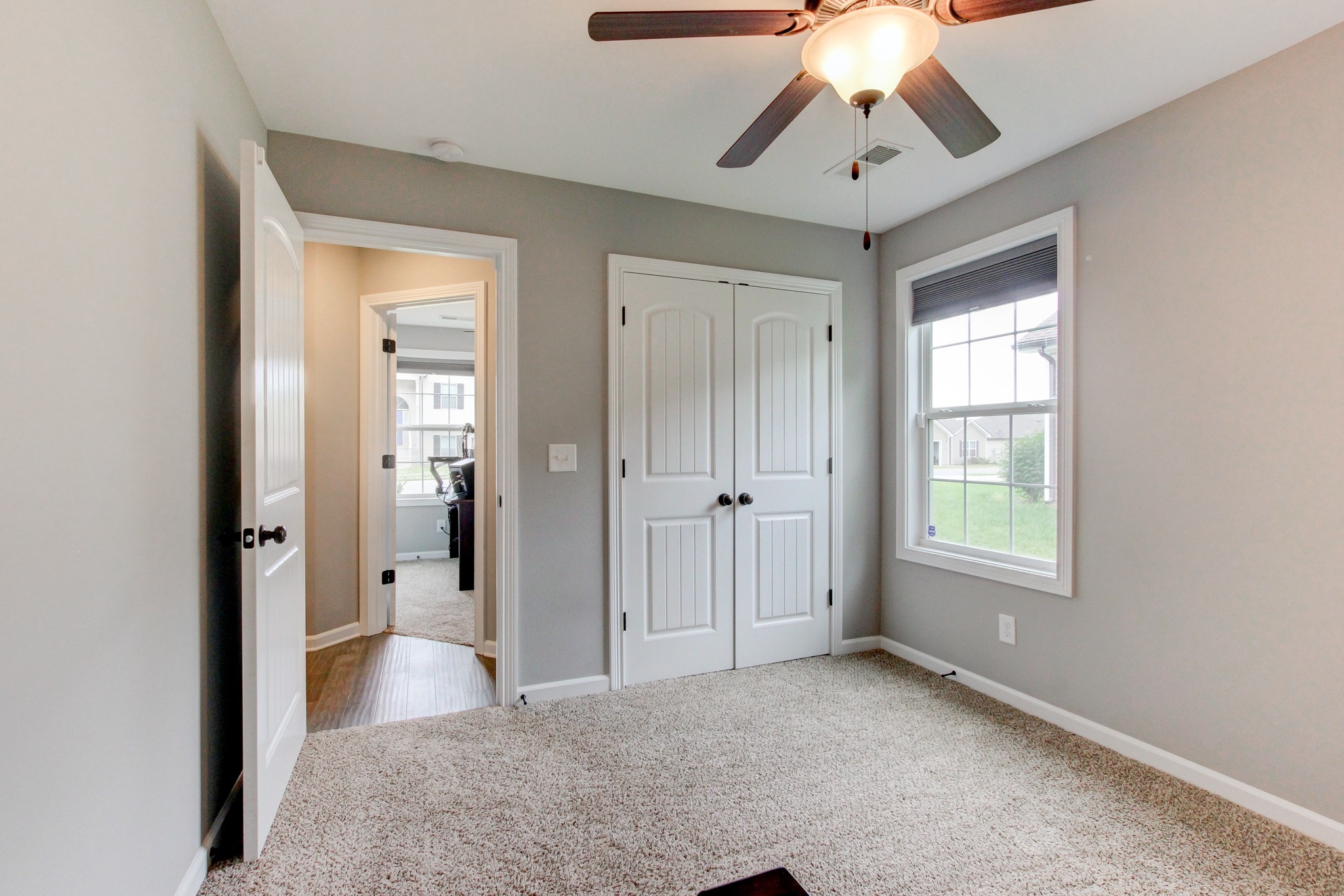 825 Rushing Drive Clarksville, TN 37042 - Photo 14 of 70 a view of empty room with window and chandelier fan