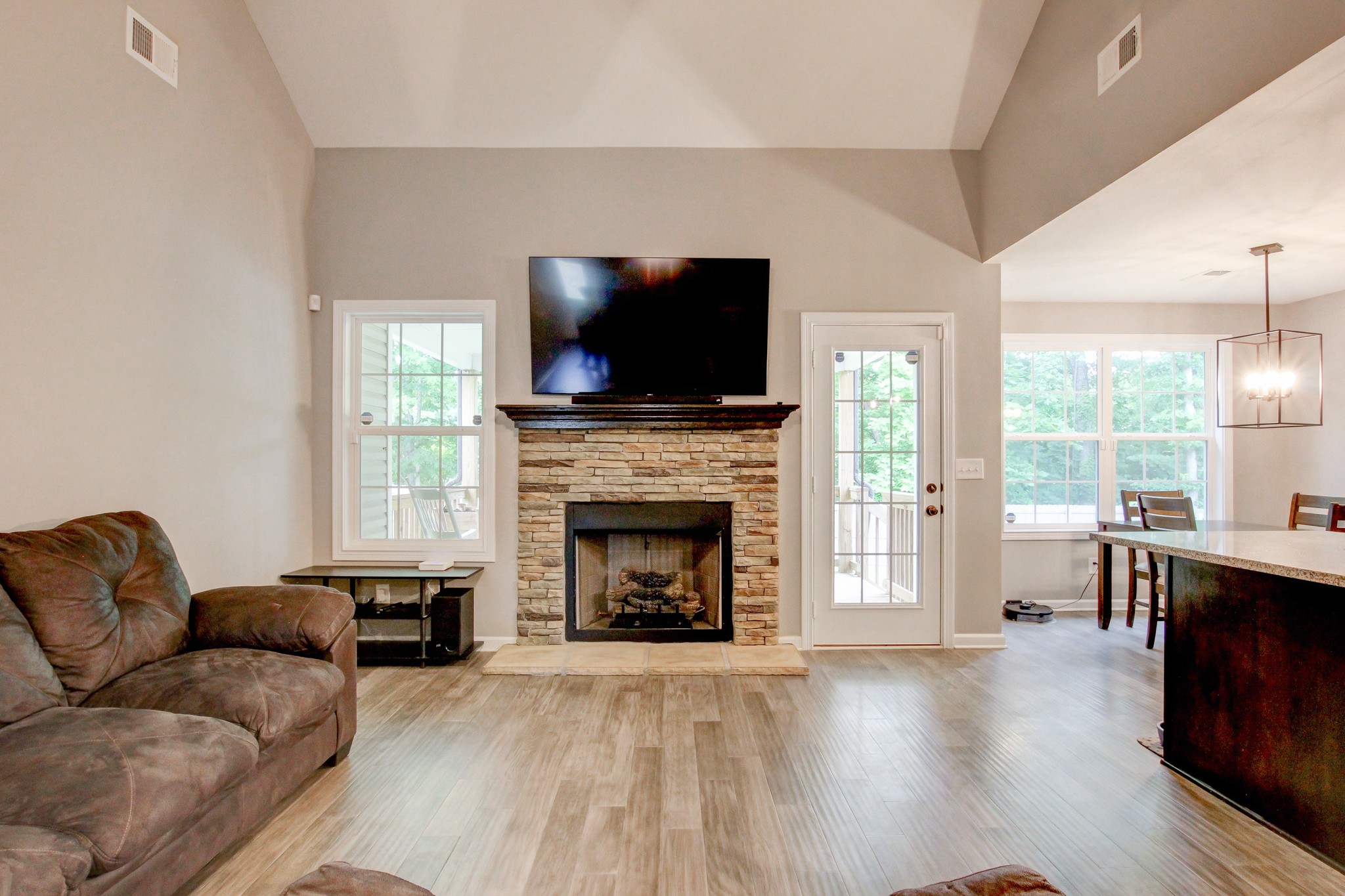 825 Rushing Drive Clarksville, TN 37042 - Photo 22 of 70 a living room with furniture a flat screen tv and a fireplace