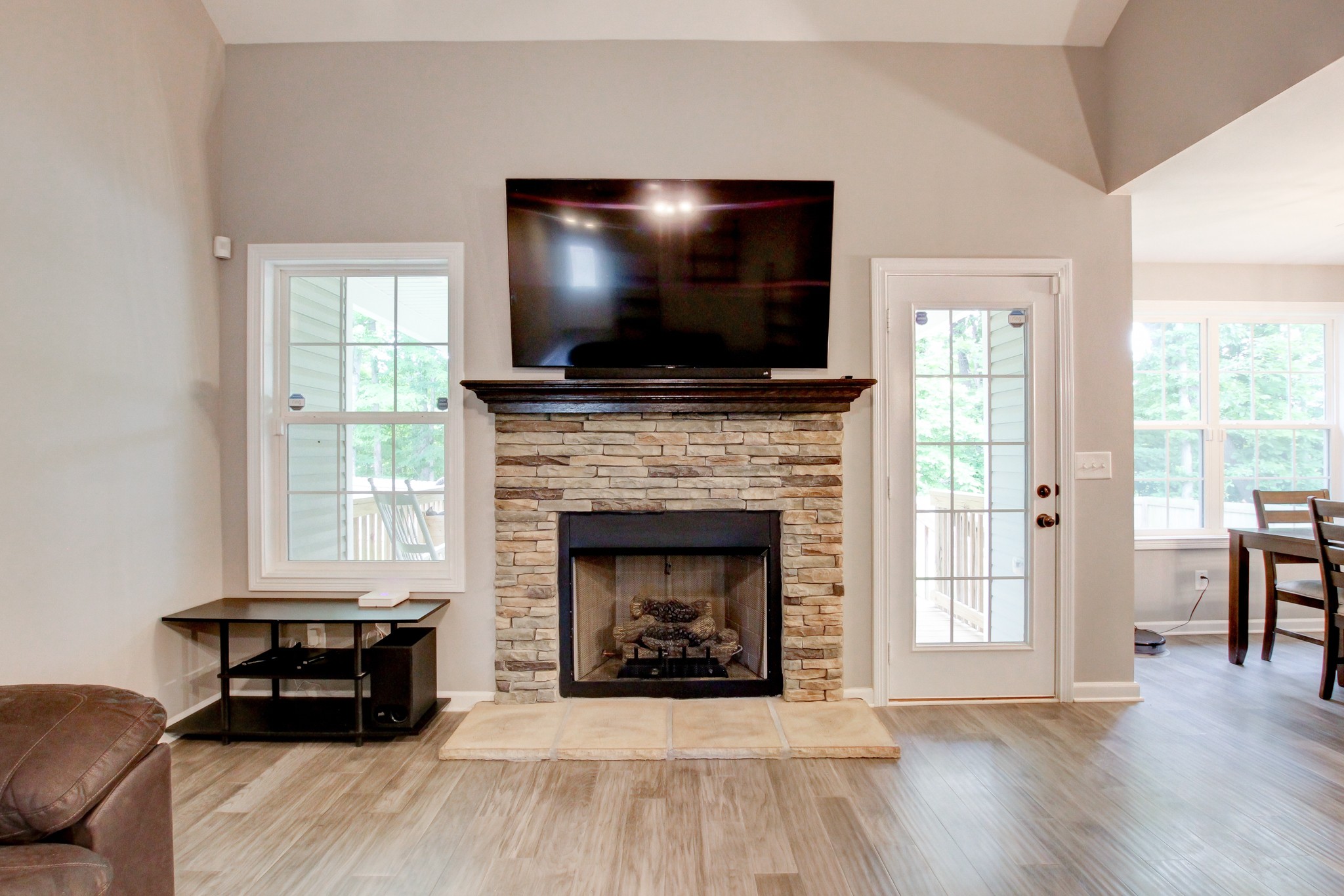 825 Rushing Drive Clarksville, TN 37042 - Photo 27 of 70 a living room with furniture a flat screen tv and a fireplace