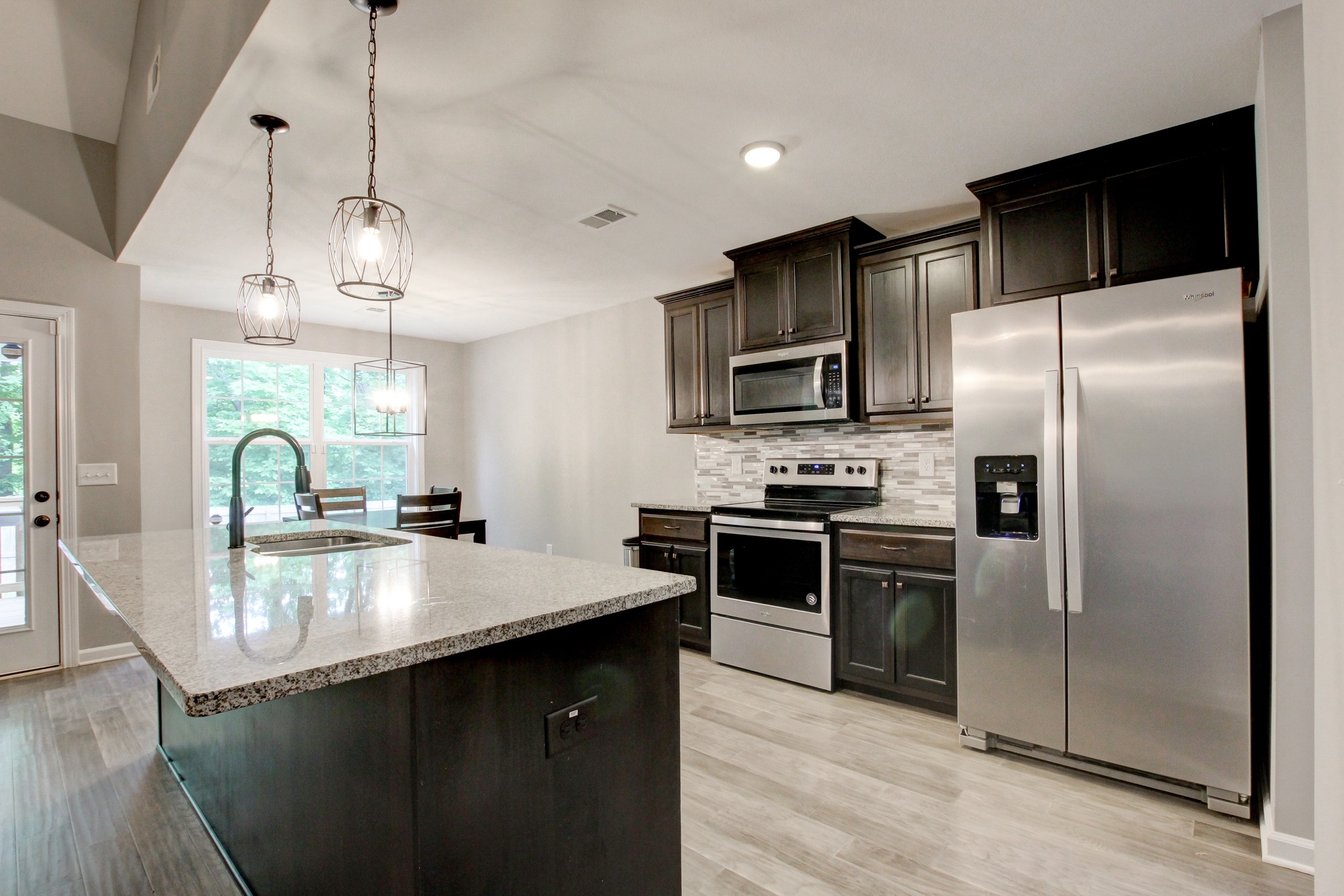 825 Rushing Drive Clarksville, TN 37042 - Photo 32 of 70 a kitchen with kitchen island a counter space a sink and stainless steel appliances