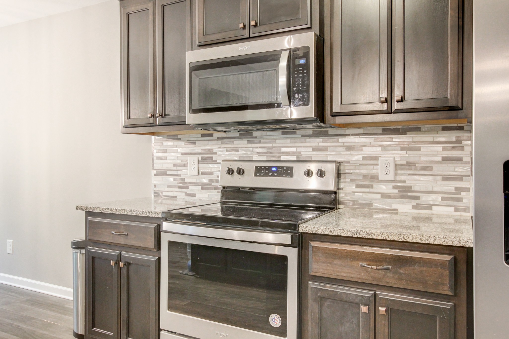 825 Rushing Drive Clarksville, TN 37042 - Photo 39 of 70 a stove top oven sitting inside of a kitchen and granite counter tops