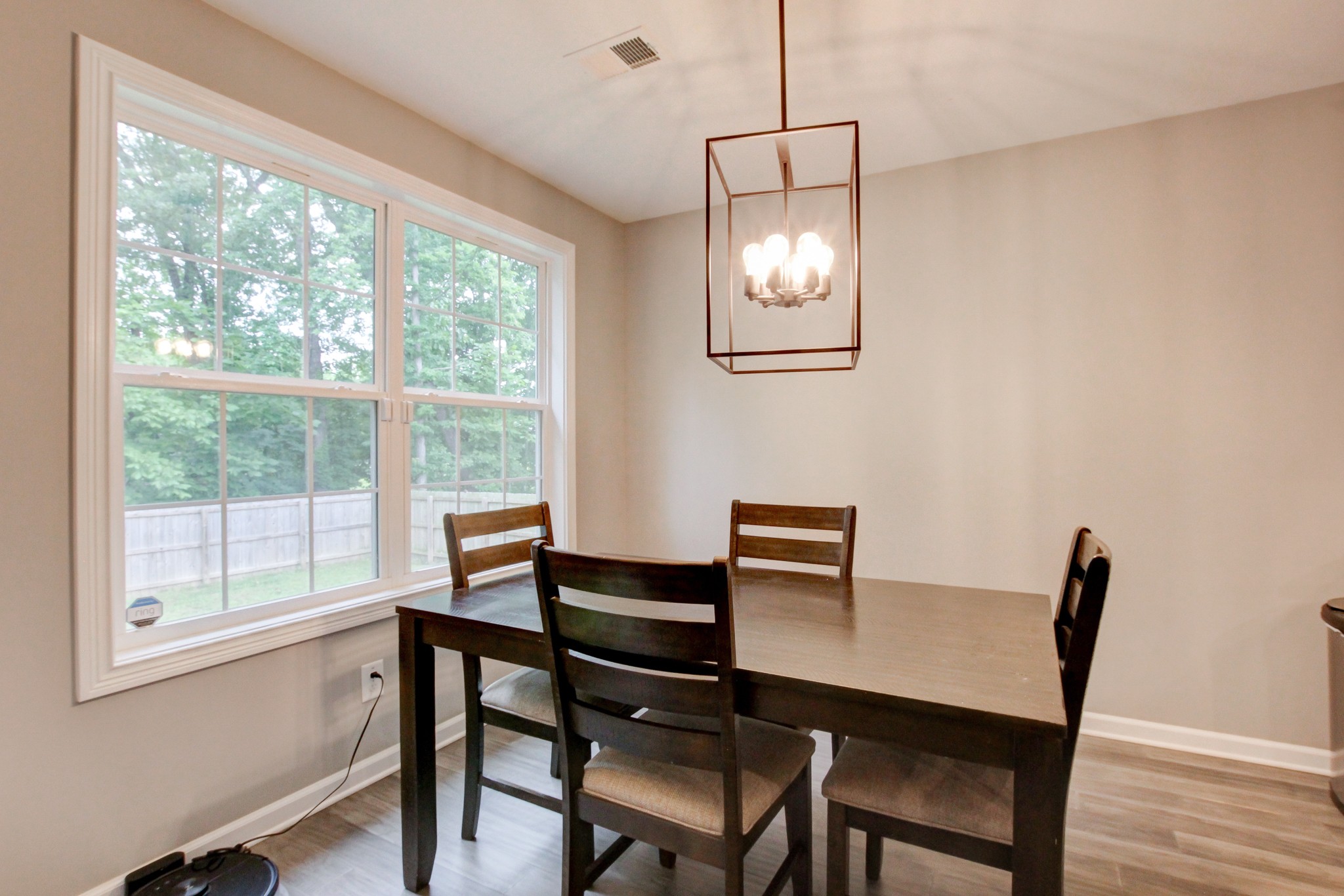 825 Rushing Drive Clarksville, TN 37042 - Photo 44 of 70 a view of a dining room with furniture window and wooden floor