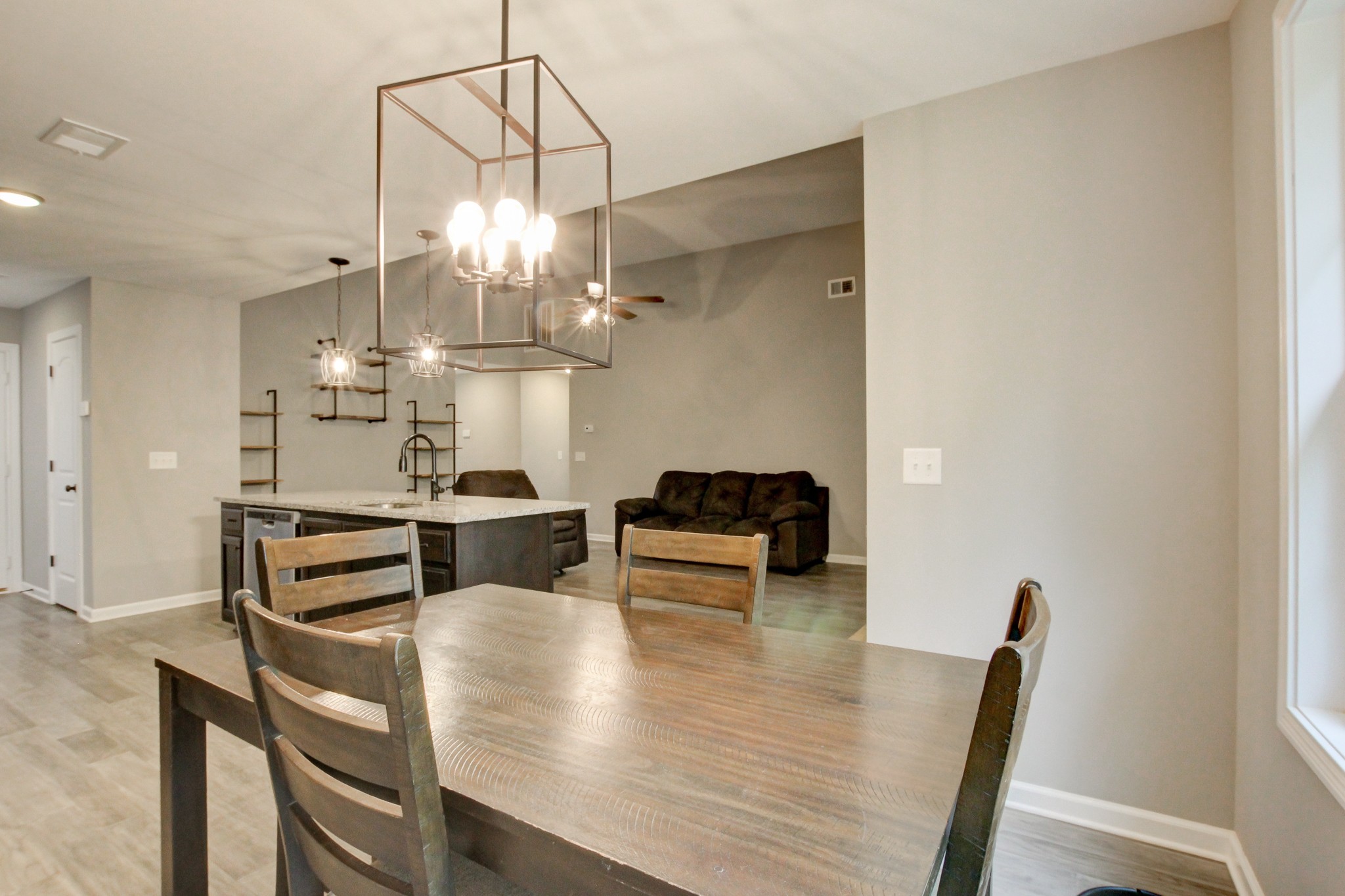 825 Rushing Drive Clarksville, TN 37042 - Photo 45 of 70 a view of a dining room with furniture and a chandelier