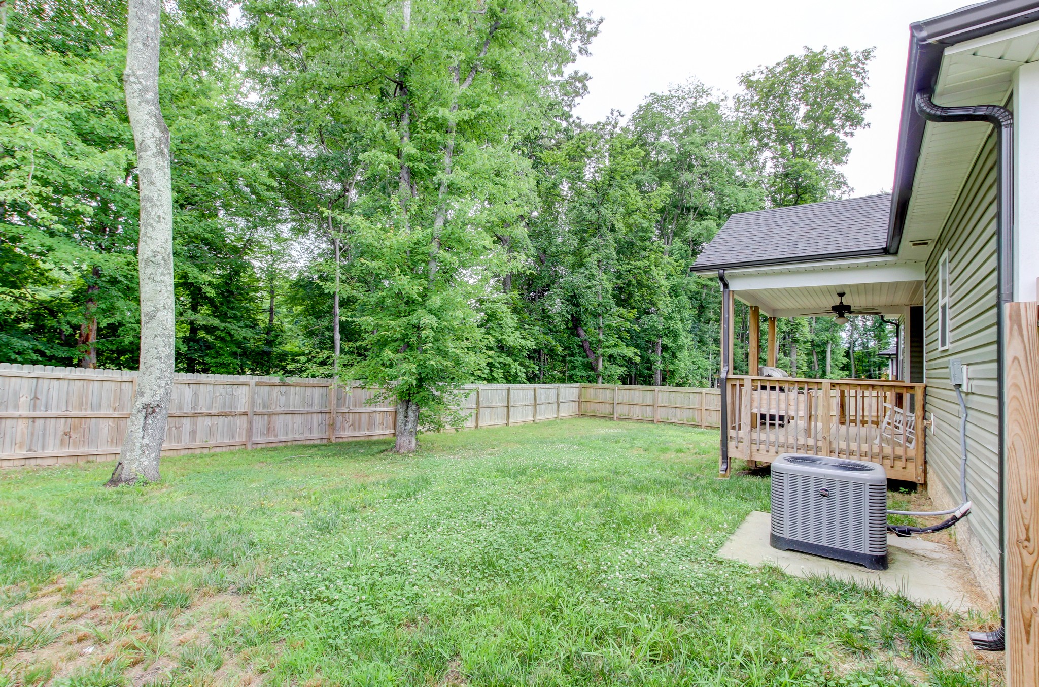 825 Rushing Drive Clarksville, TN 37042 - Photo 70 of 70 a view of a backyard with a garden and deck