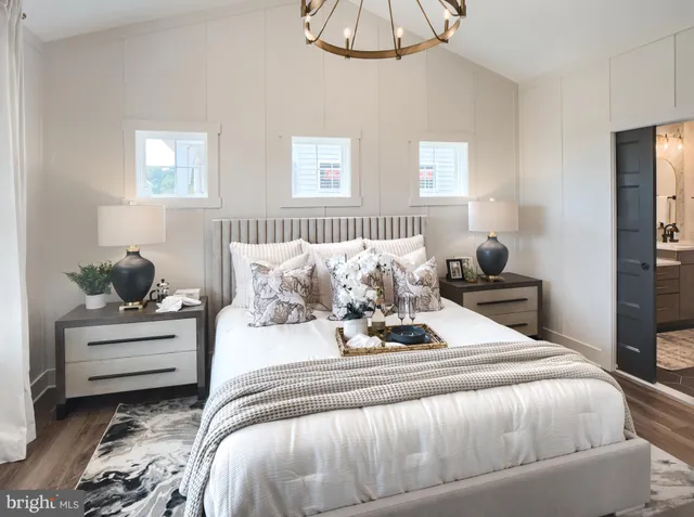 a bedroom with bed and a window