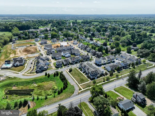 an aerial view of residential houses and outdoor space