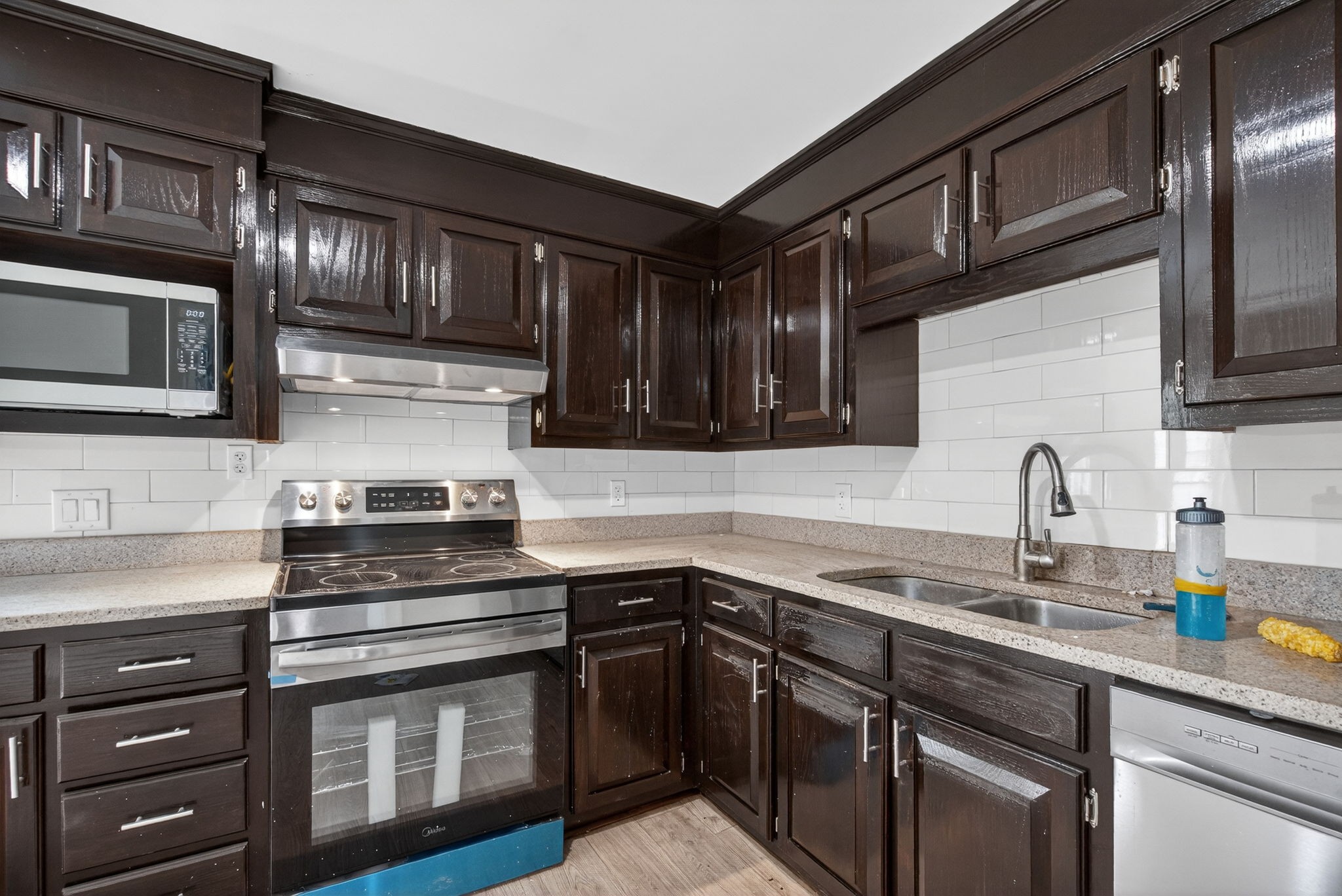 946 Clearview Road Cottontown, TN 37048 - Photo 6 of 33 a kitchen with stainless steel appliances granite countertop a sink stove and cabinets