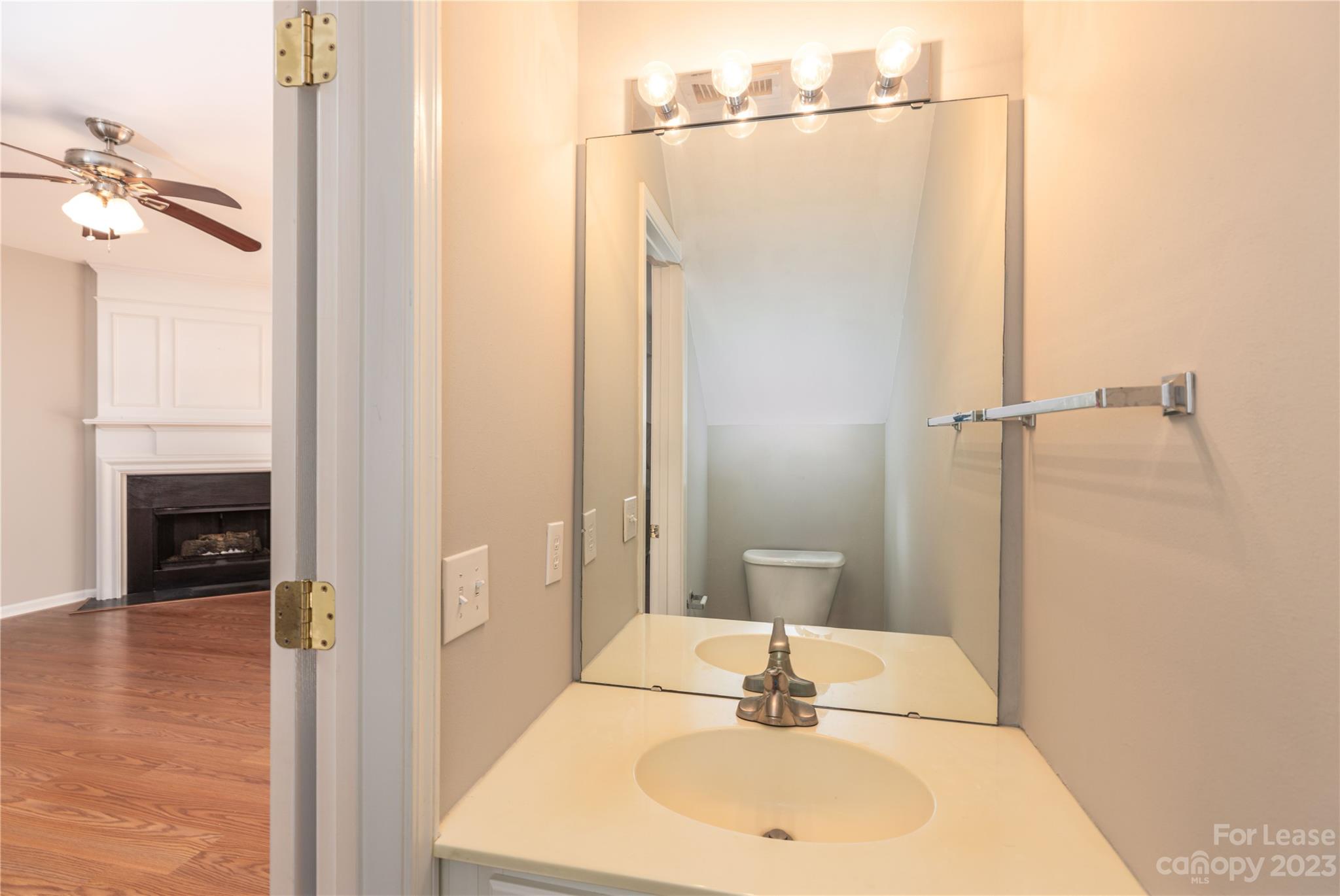 6879 Rothchild Drive Charlotte, NC 28270 - Photo 11 of 19 a bathroom with a sink and a mirror