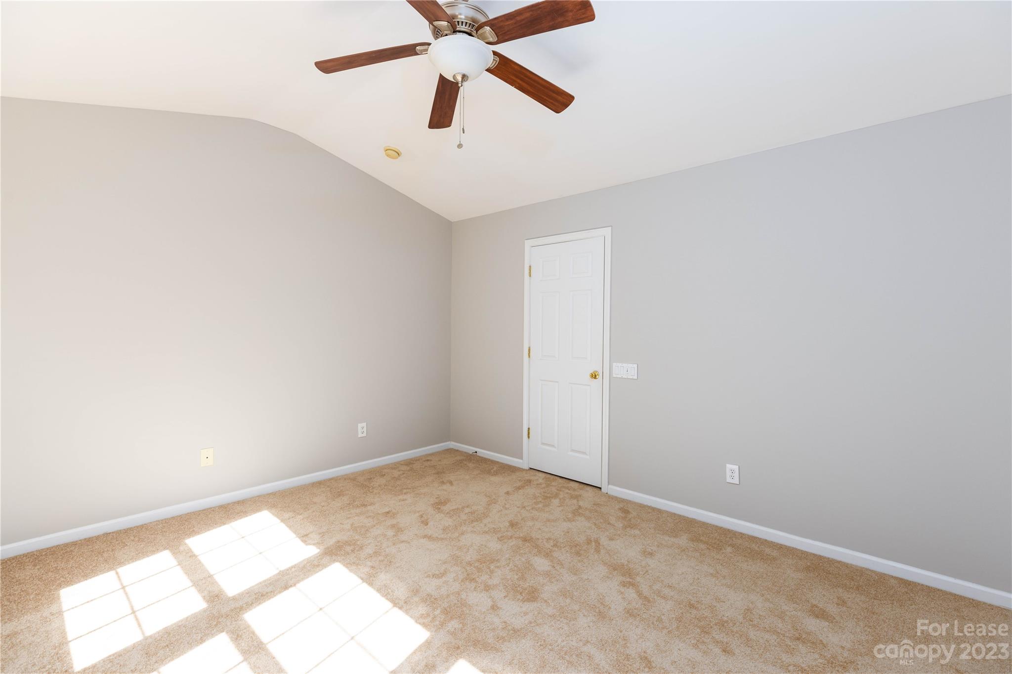 6879 Rothchild Drive Charlotte, NC 28270 - Photo 13 of 19 an empty room with a window and a fan