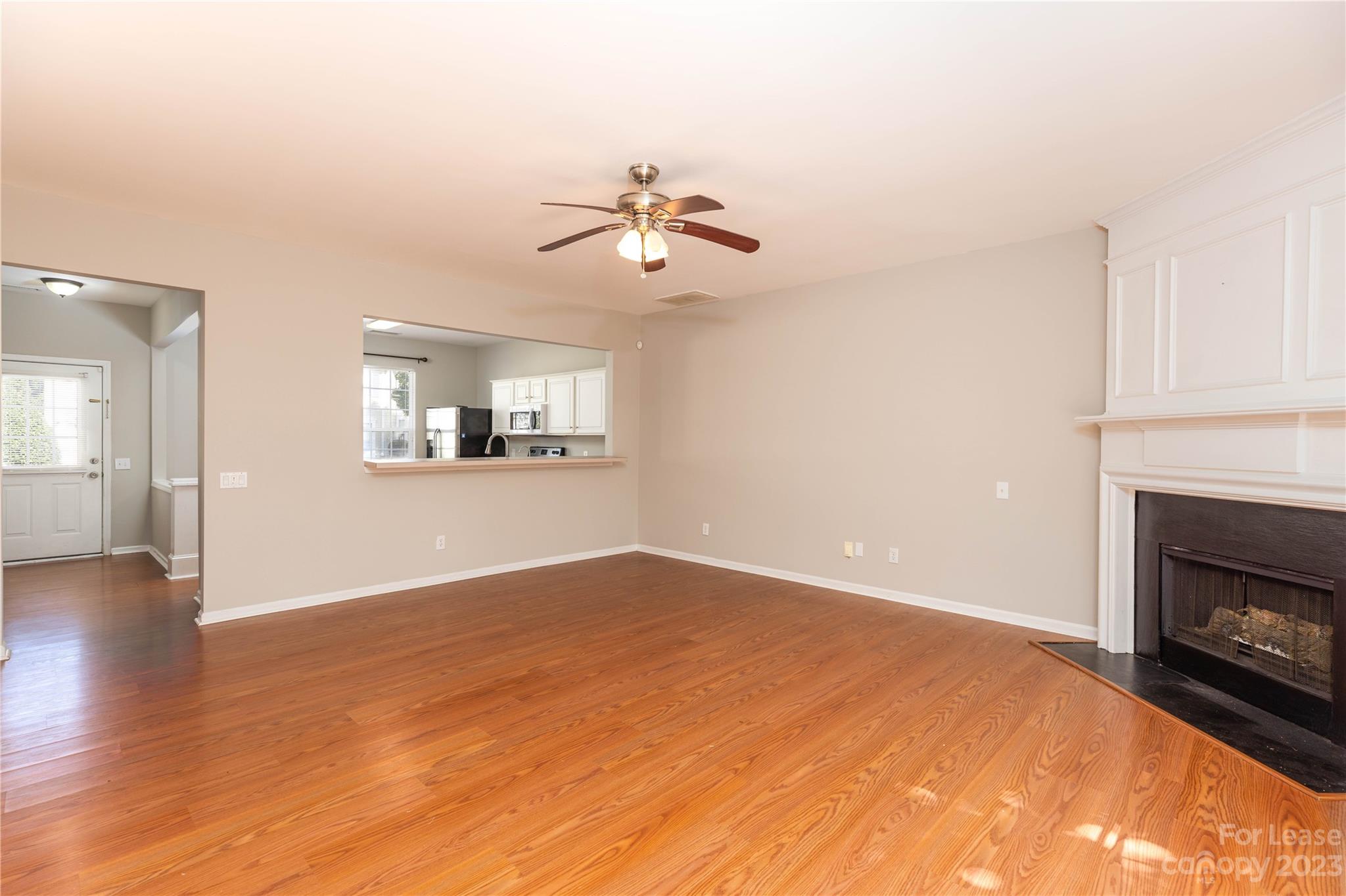 6879 Rothchild Drive Charlotte, NC 28270 - Photo 10 of 19 an empty room with windows and fireplace
