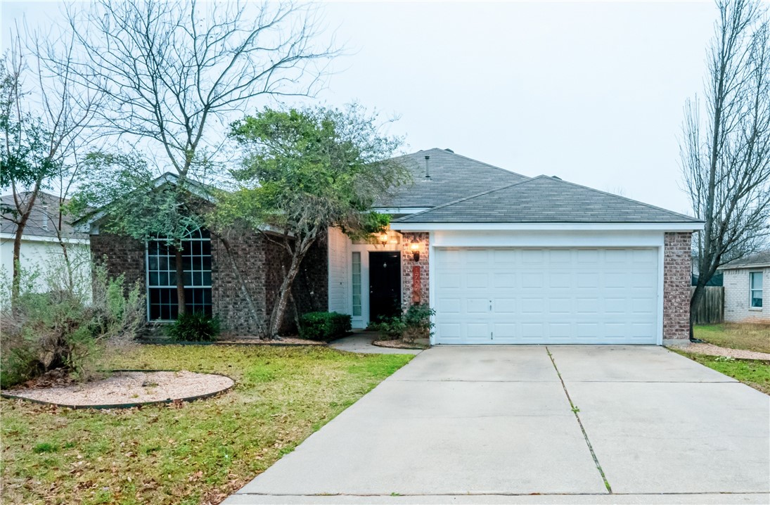 1707 Greening Way Leander, TX 78641 - Photo 1 of 1 a front view of a house with a yard and garage