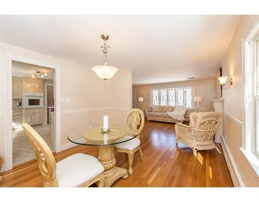 352 Appleton Street Arlington, MA 02476 - Photo 8 of 30 a living room with furniture a dining table and a chandelier