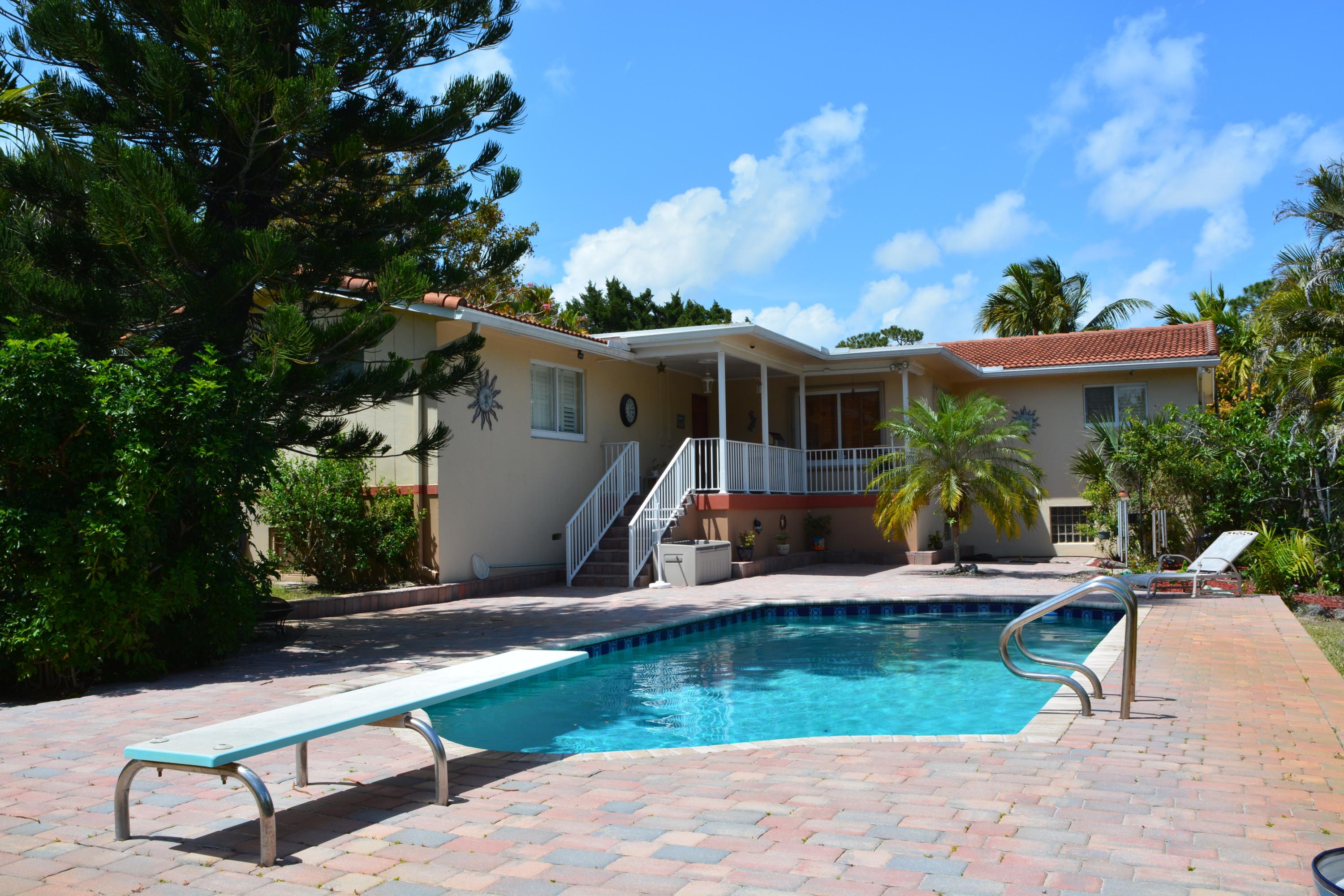 7495 High Ridge Road Lake Worth, FL 33462 - Photo 3 of 5 a view of a house with backyard and sitting area