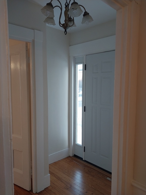 49 Salem Street, Unit 1 Haverhill, MA 01835 - Photo 16 of 16 a view of empty room with wooden floor